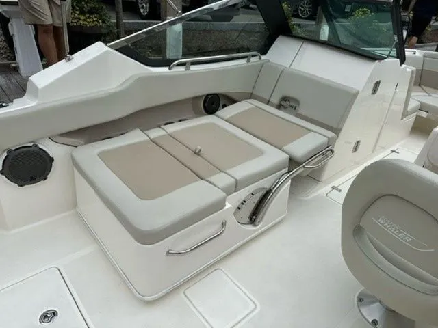 Slide: The Image of 2023 Boston Whaler 240 Vantage boat interior with beige seating and modern design. - 10