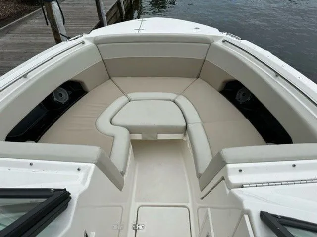 Slide: The Image of 2023 Boston Whaler 240 Vantage boat with spacious seating area and sleek design. - 14