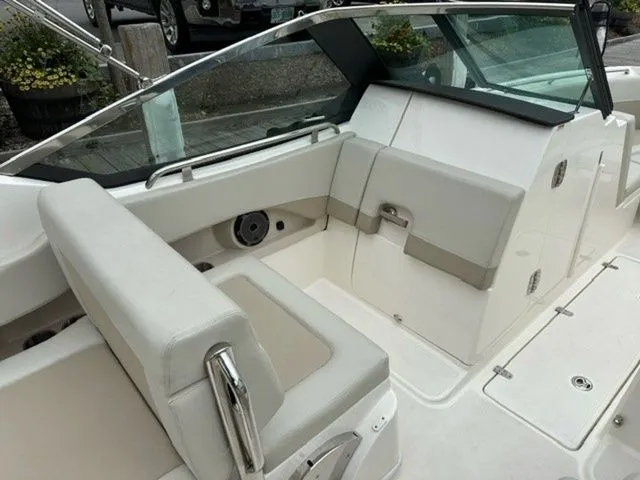 Slide: The Image of 2023 Boston Whaler 240 Vantage boat interior with white seating and sleek design. - 16