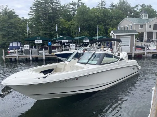 Slide: The Image of 2023 Boston Whaler 240 Vantage boat docked at marina with for sale signs. - 2