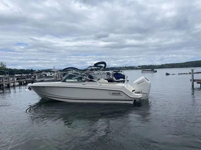 Slide: The Image of 2023 Boston Whaler 240 Vantage boat docked on a cloudy day. - 5