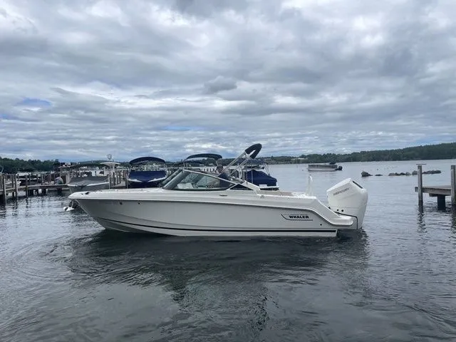 Slide: The Image of 2023 Boston Whaler 240 Vantage boat docked on a cloudy day. - 6
