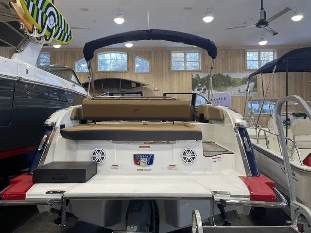 Slide: The Image of 2025 Cobalt R6 boat in showroom, featuring sleek design and modern amenities. - 2