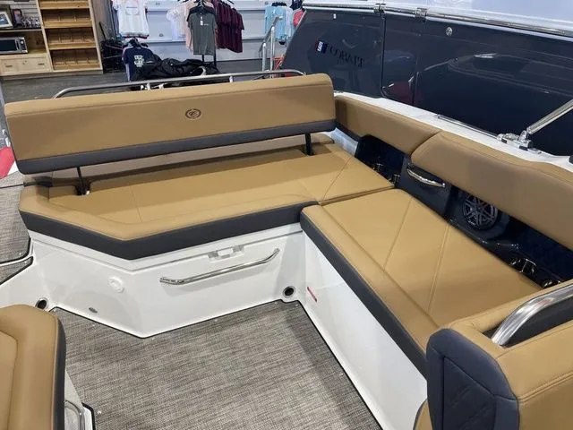 Slide: The Image of 2025 Cobalt R6 boat interior with tan and black seating, showcasing luxury and comfort. - 5
