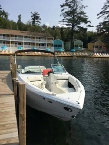 Slide: The Image of 2016 Cobalt R7 boat docked by lakeside cabins. - 3