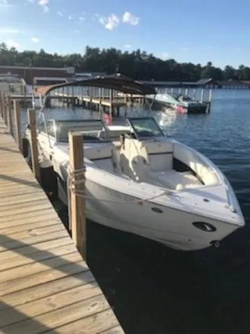 Slide: The Image of 2016 Cobalt R7 boat docked at a sunny lakeside marina. - 4