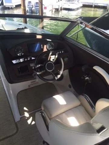 Slide: The Image of 2016 Cobalt R7 boat cockpit with steering wheel and dashboard controls. - 6