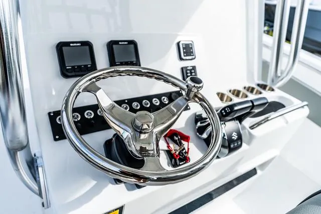 Slide: The Image of Steering console of 2025 Cape Horn 31T boat with modern controls and displays. - 11