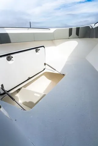 Slide: The Image of 2025 Cape Horn 31T boat storage compartment with open hatch, showcasing spacious interior. - 16