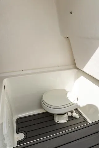 Slide: The Image of 2025 Cape Horn 31T boat interior with compact marine toilet. - 17