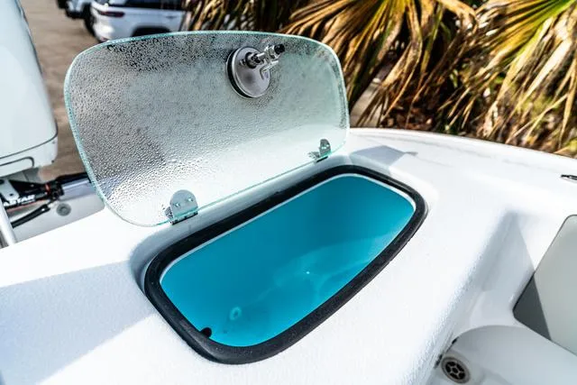 Slide: The Image of Open storage compartment on 2025 Cape Horn 31T boat, featuring a blue interior. - 20