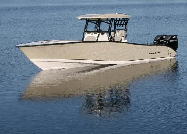Slide: The Image of 2025 Cape Horn 31T boat on calm water, featuring dual outboard engines. - 22