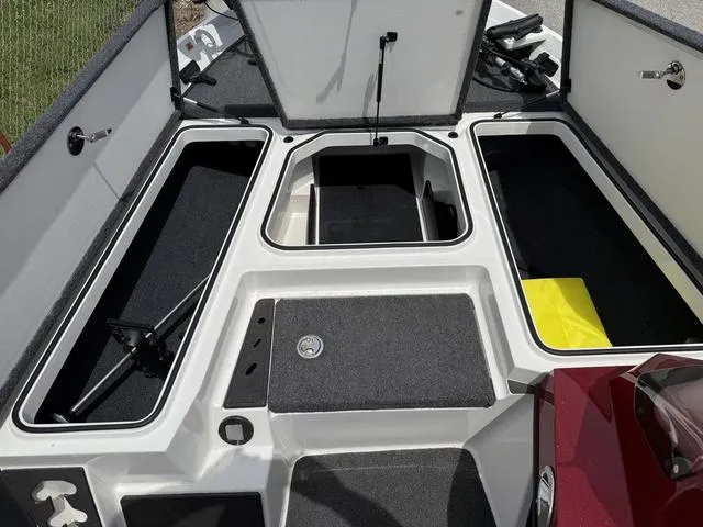 Slide: The Image of 2019 Ranger Z175 boat storage compartments with open hatches, showcasing ample space and organization. - 10