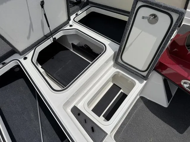 Slide: The Image of 2019 Ranger Z175 boat storage compartments with open lids, showcasing ample space and organization. - 11
