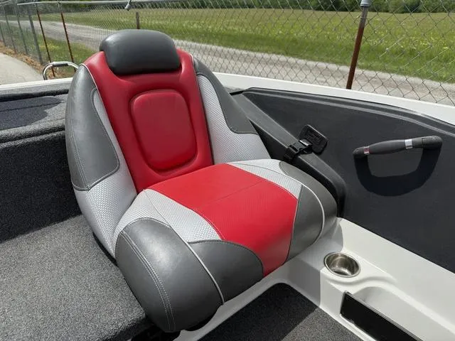 Slide: The Image of Red and gray seat in 2019 Ranger Z175 boat, near a chain-link fence. - 13