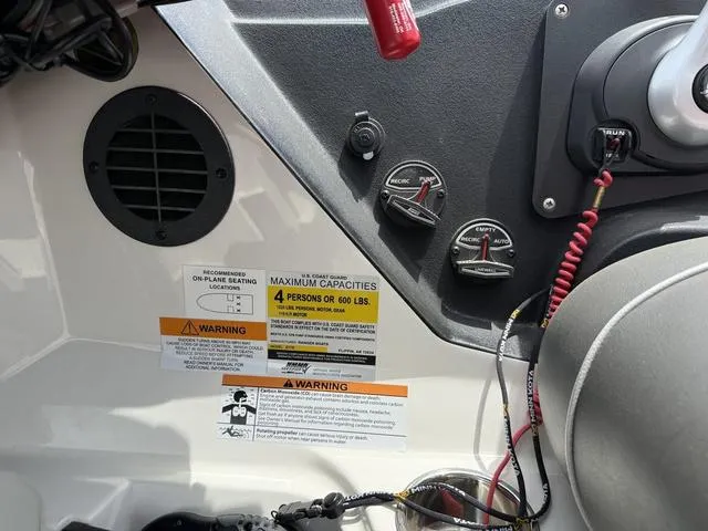 Slide: The Image of Control panel of a 2019 Ranger Z175 boat with capacity and warning labels. - 15
