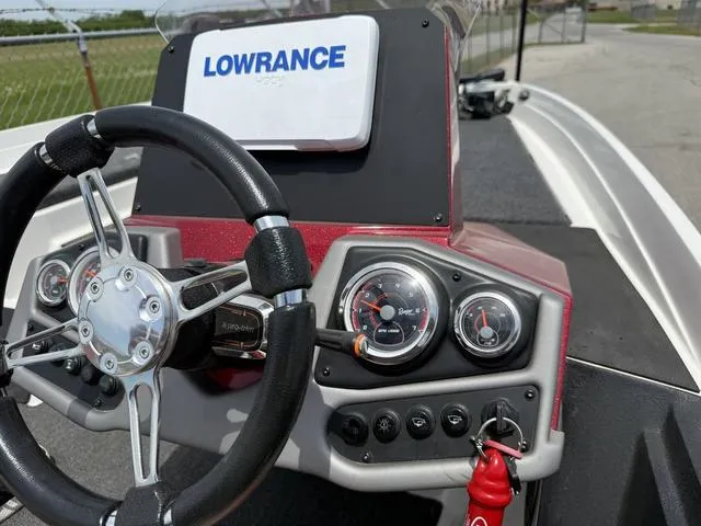 Slide: The Image of 2019 Ranger Z175 boat dashboard with steering wheel and Lowrance GPS system. - 17