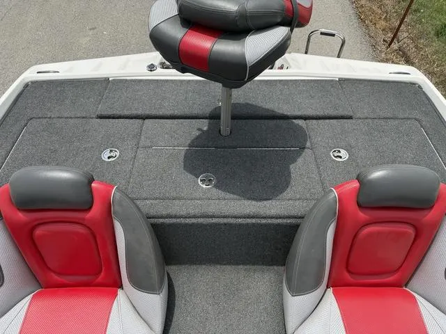 Slide: The Image of 2019 Ranger Z175 boat interior with red and gray seats, featuring a central elevated seat. - 19