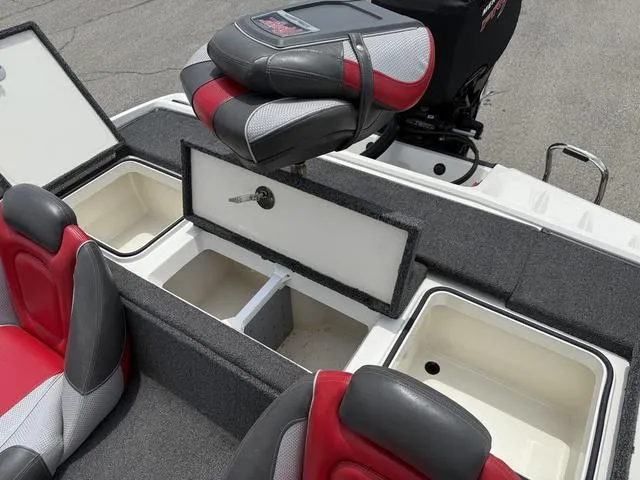 Slide: The Image of 2019 Ranger Z175 boat interior with storage compartments and red-gray seating. - 20