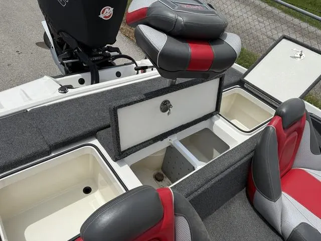 Slide: The Image of 2019 Ranger Z175 boat interior with storage compartments and red-gray seating. - 21