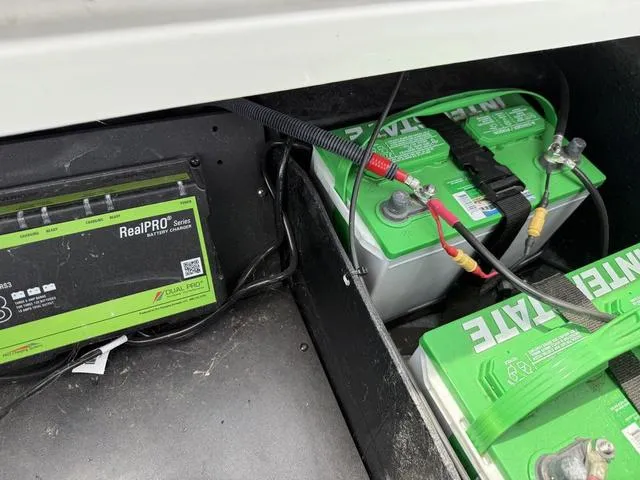 Slide: The Image of Battery compartment of 2019 Ranger Z175 with RealPRO charger and Interstate batteries. - 22