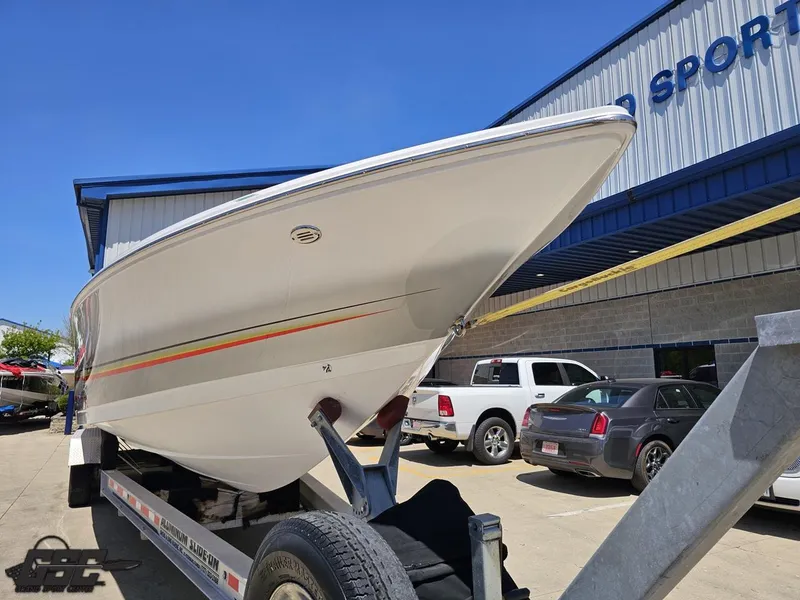 Slide: The Image of 2007 Donzi 38 ZR boat on trailer outside a sports facility. - 16