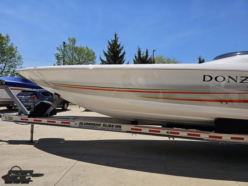 Slide: The Image of 2007 Donzi 38 ZR speedboat on aluminum trailer, parked outdoors. - 20