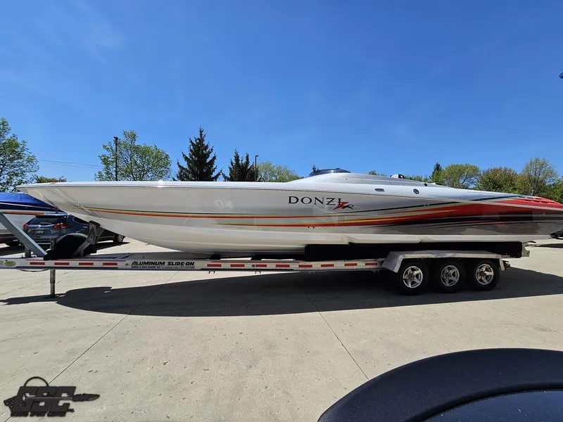 Slide: The Image of 2007 Donzi 38 ZR speedboat on trailer under clear blue sky. - 22