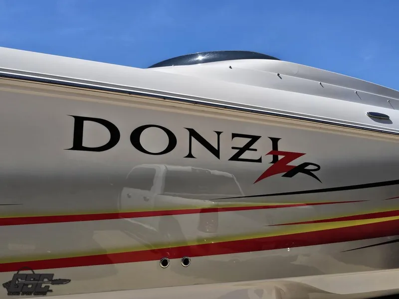 Slide: The Image of 2007 Donzi 38 ZR boat with sleek design and vibrant graphics. - 23