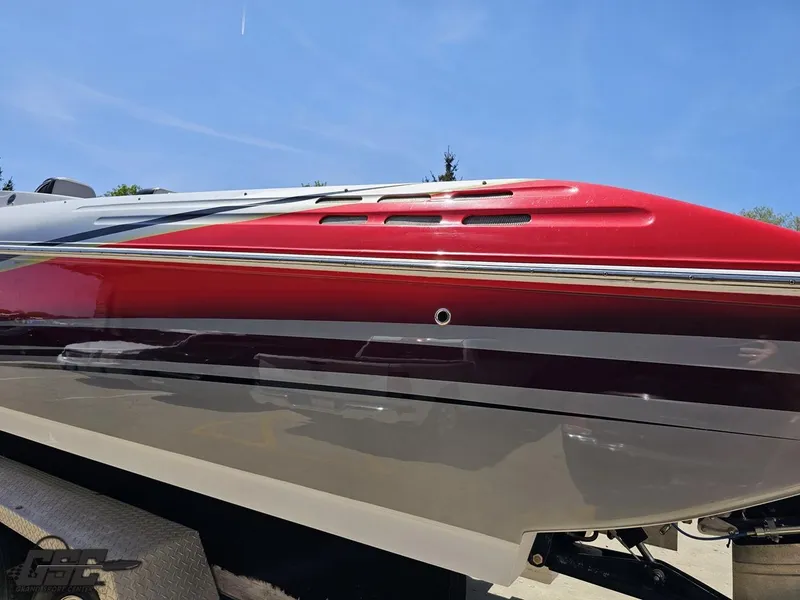 Slide: The Image of 2007 Donzi 38 ZR boat with sleek red and gray design on a trailer. - 27