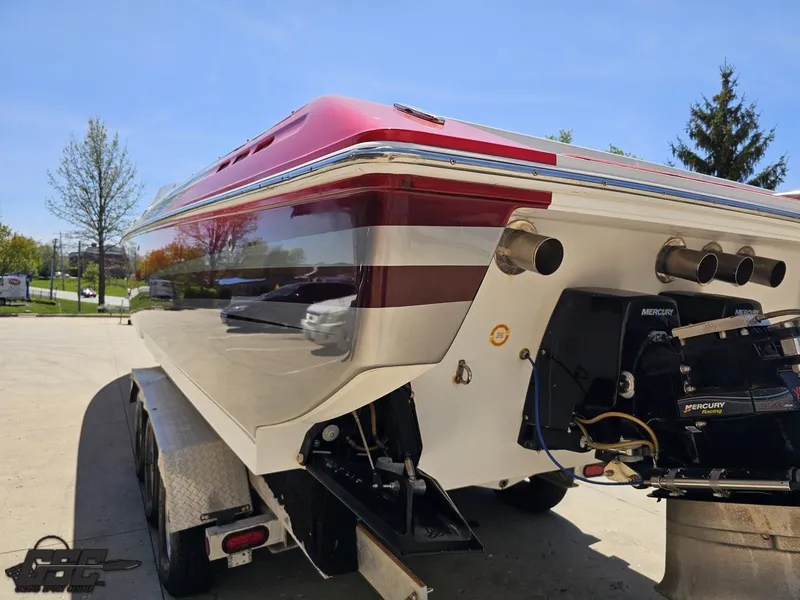 Slide: The Image of 2007 Donzi 38 ZR boat on trailer, rear view, showcasing sleek design and powerful engines. - 29