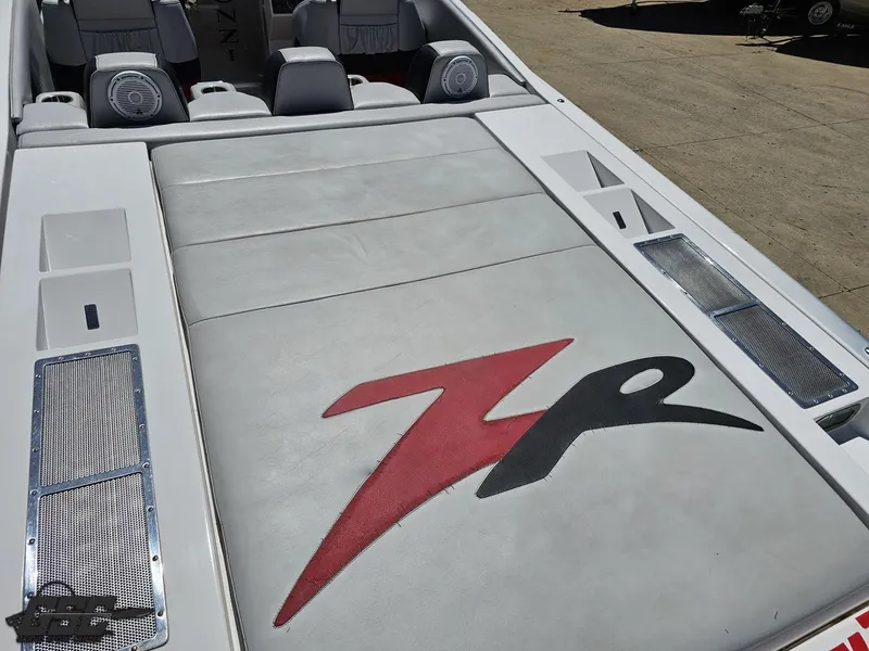 Slide: The Image of 2007 Donzi 38 ZR boat interior with logo, featuring white and red upholstery. - 35