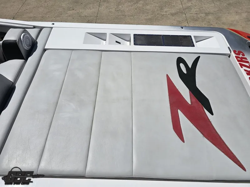 Slide: The Image of 2007 Donzi 38 ZR boat interior with logo, featuring sleek white and red design. - 43