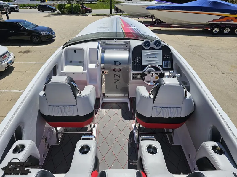 Slide: The Image of 2007 Donzi 38 ZR speedboat interior with modern dashboard and seating. - 45