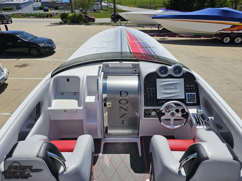 Slide: The Image of 2007 Donzi 38 ZR speedboat cockpit with Garmin navigation, sleek design, and modern controls. - 47