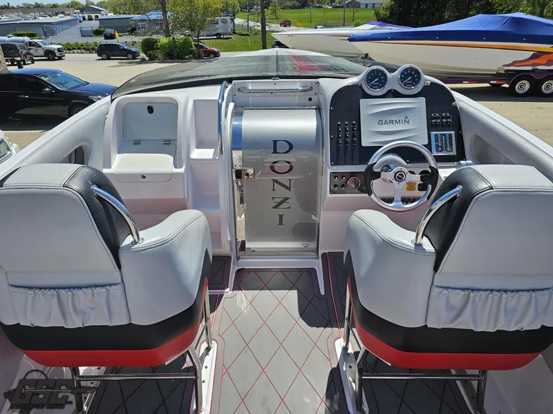 Slide: The Image of 2007 Donzi 38 ZR boat cockpit with dual seats and Garmin navigation system. - 49