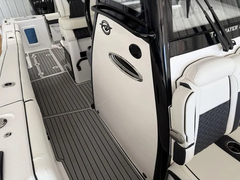 Slide: The Image of 2025 Tidewater 282 CC Adventure boat interior with sleek seating and modern design. - 12