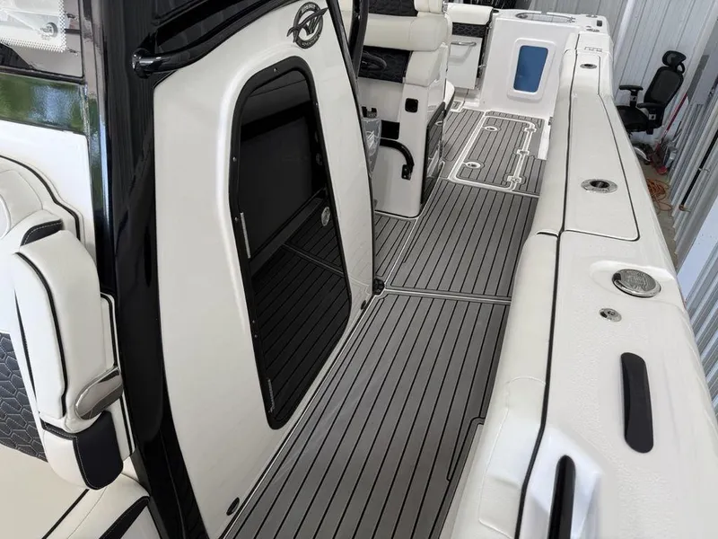 Slide: The Image of 2025 Tidewater 282 CC Adventure boat interior with sleek seating and modern design. - 14
