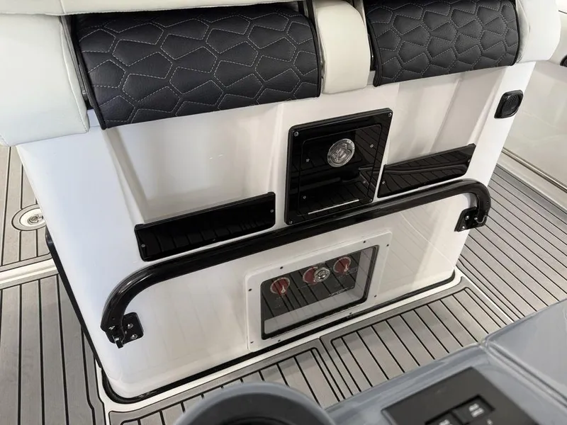 Slide: The Image of 2025 Tidewater 282 CC Adventure boat interior with sleek seating and modern controls. - 18