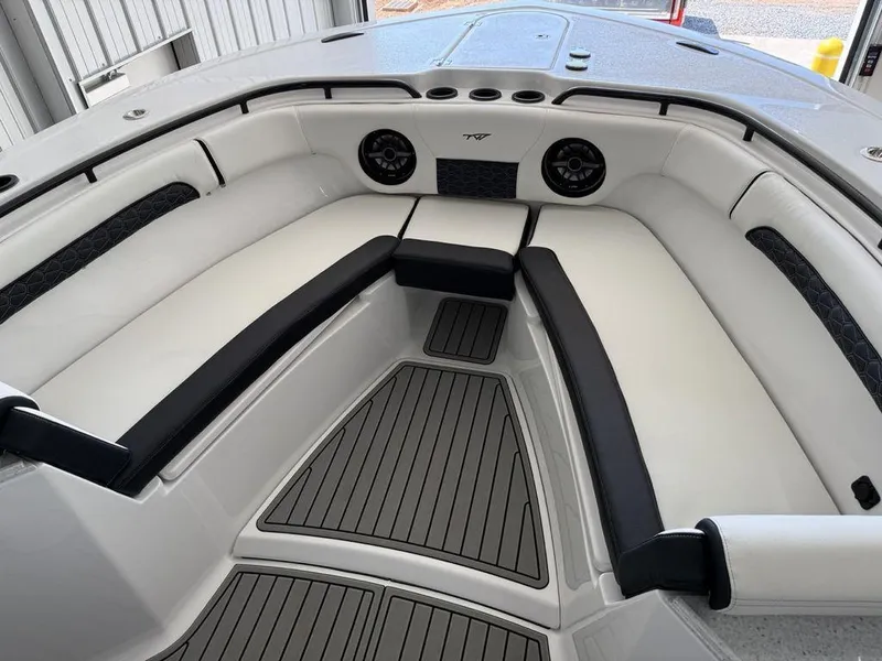 Slide: The Image of 2025 Tidewater 282 CC Adventure boat interior with cushioned seating and modern design. - 3