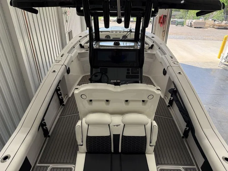 Slide: The Image of 2025 Tidewater 282 CC Adventure boat interior with dual seats and modern dashboard. - 36