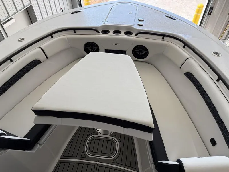 Slide: The Image of 2025 Tidewater 282 CC Adventure boat interior with cushioned seating and modern design. - 4
