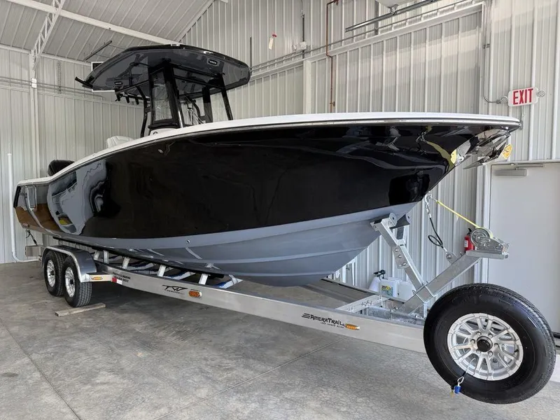 Slide: The Image of 2025 Tidewater 282 CC Adventure boat on trailer in storage facility. - 5