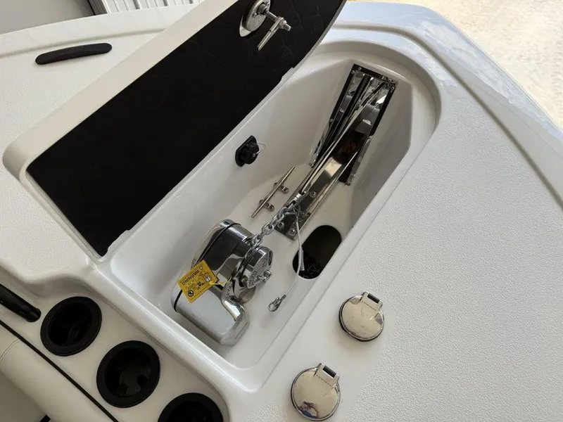 Slide: The Image of 2025 Tidewater 282 CC Adventure boat anchor compartment with stainless steel fittings. - 7