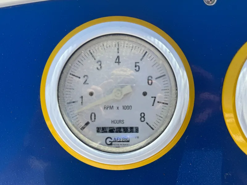 Slide: The Image of Tachometer of 2000 Formula 271 FASTech boat, displaying RPM and hours. - 10