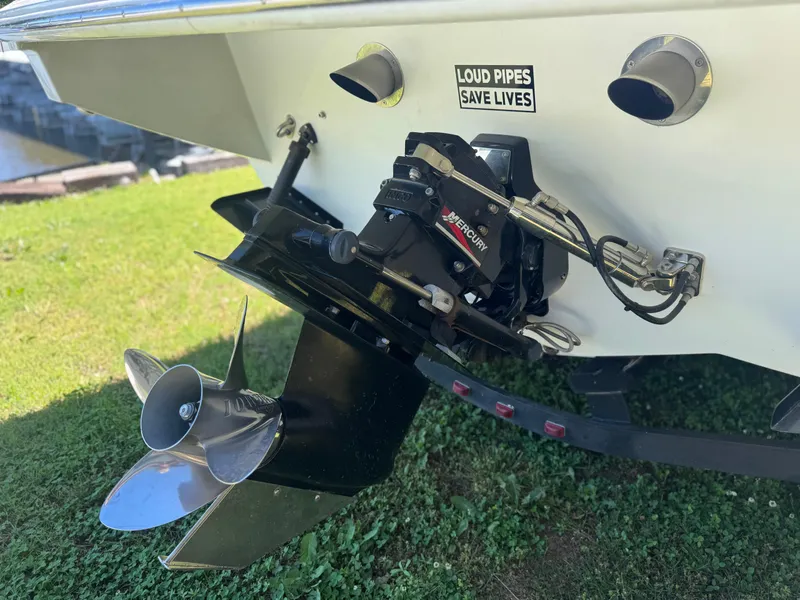 Slide: The Image of Rear view of 2000 Formula 271 FASTech boat with dual exhaust and propeller. - 16