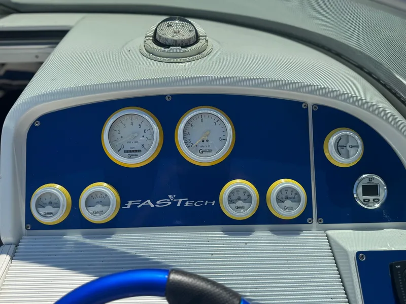 Slide: The Image of Dashboard of a 2000 Formula 271 FASTech boat with gauges and controls. - 17