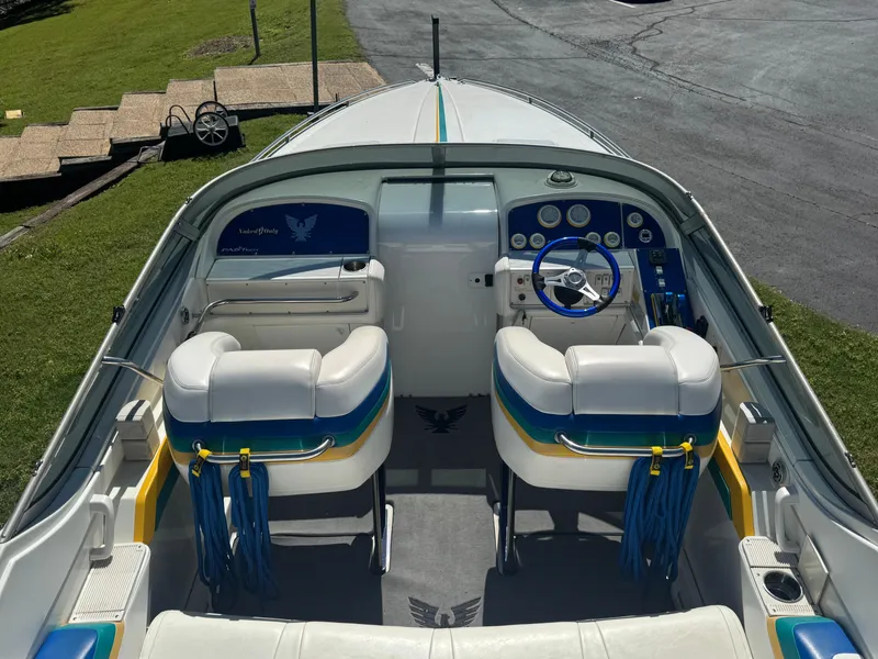 Slide: The Image of 2000 Formula 271 FASTech boat interior with dual seats and steering wheel. - 4