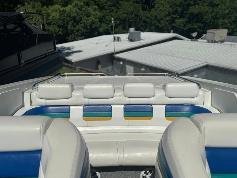 Slide: The Image of 2000 Formula 271 FASTech boat interior with white and blue seating. - 7
