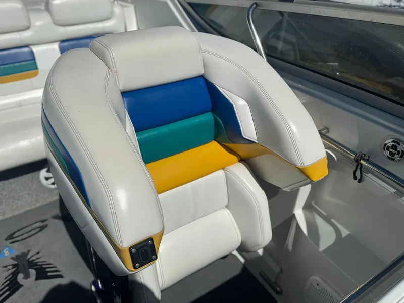 Slide: The Image of 2000 Formula 271 FASTech boat seat with colorful upholstery in white, blue, green, and yellow. - 8